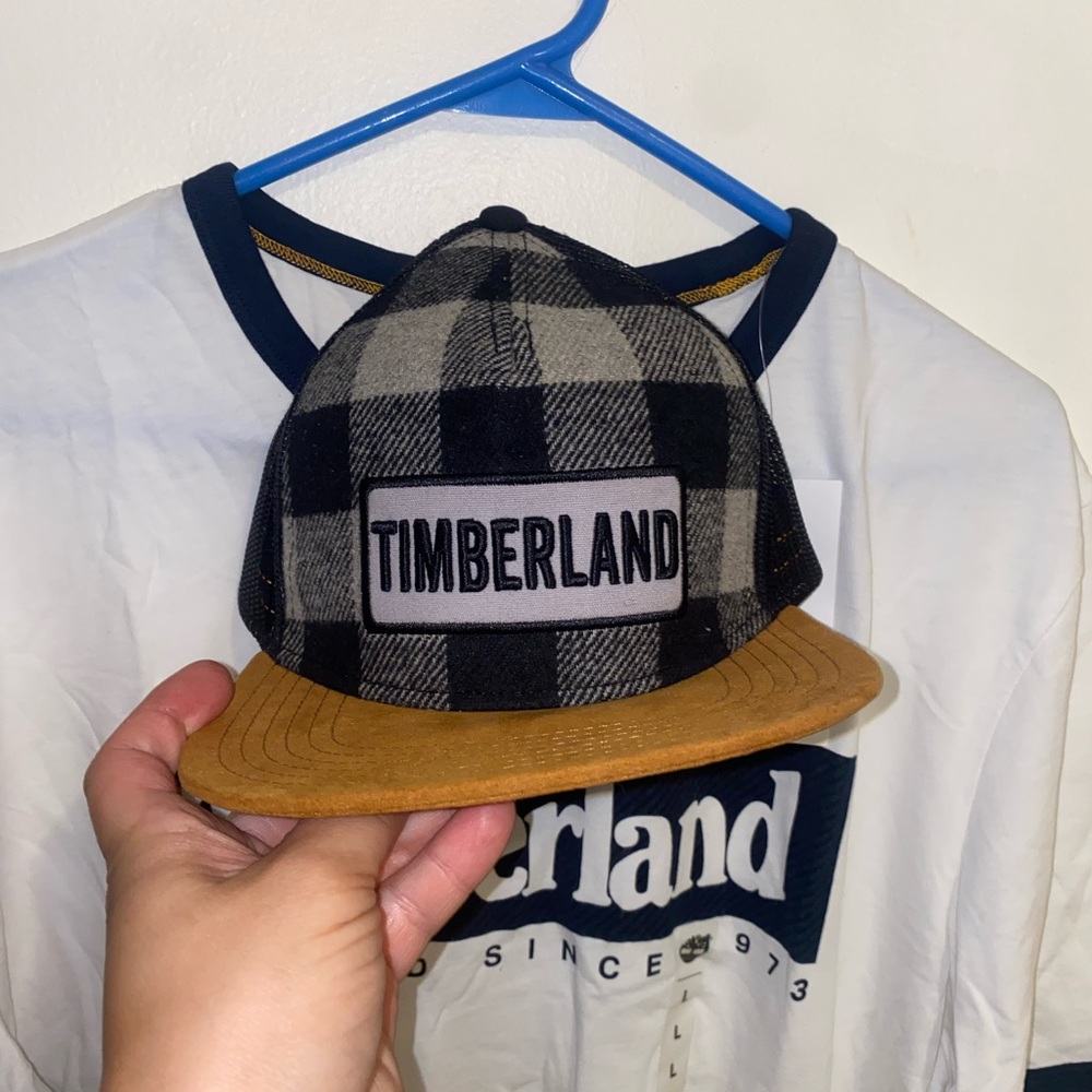 Two brand-new timberland shirts and a Timberland hat